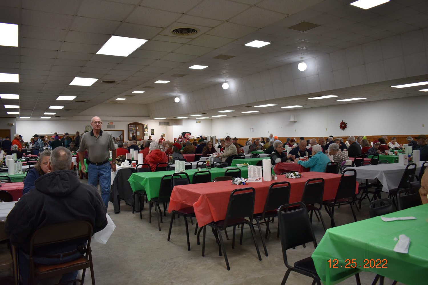 Members of Knights of Columbus Jay Harris Council 8620 and Ladies Auxiliary in Warsaw serve the council’s 37th annual Christmas Dinner on Dec. 25, 2022. Volunteers served between 350 and 400 meals to people who were hungry, homebound or otherwise in need of a good meal and cheerful company on Christmas Day.
